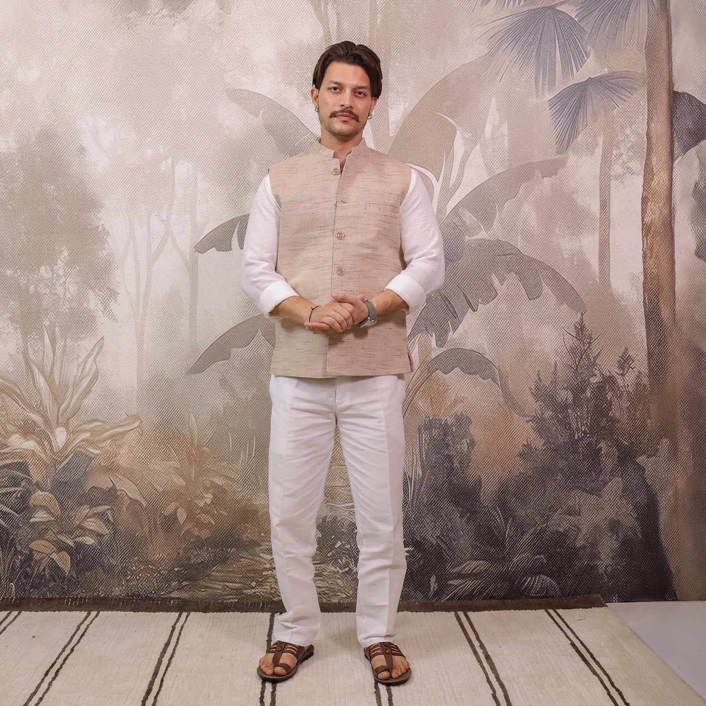 Full-length view of Skin Tone Cotton Bhagalpur Nehru Jacket for Men styled with a white kurta and pajama.