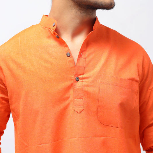 Orange khadi cotton kurta close-up showing placket buttons and chest pocket detail
