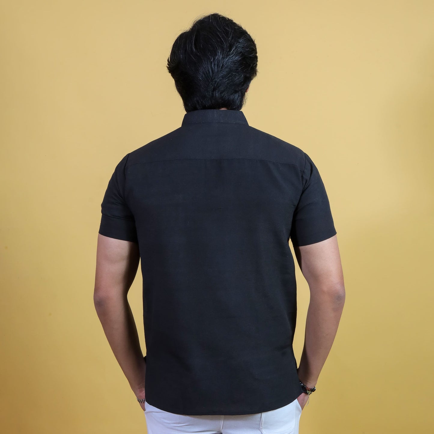 Back view black solid khadi short kurta for men