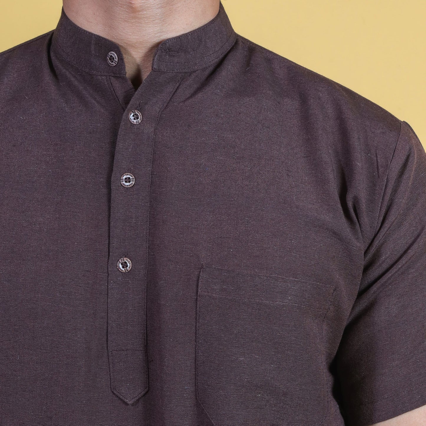 Close-up brown khadi kurta mandarin collar and fabric texture