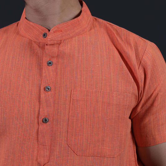 Close-up of orange khadi kurta showing thread line texture mandarin collar and chest pocket
