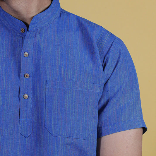 Close-up of blue khadi kurta fabric showing fine thread line texture