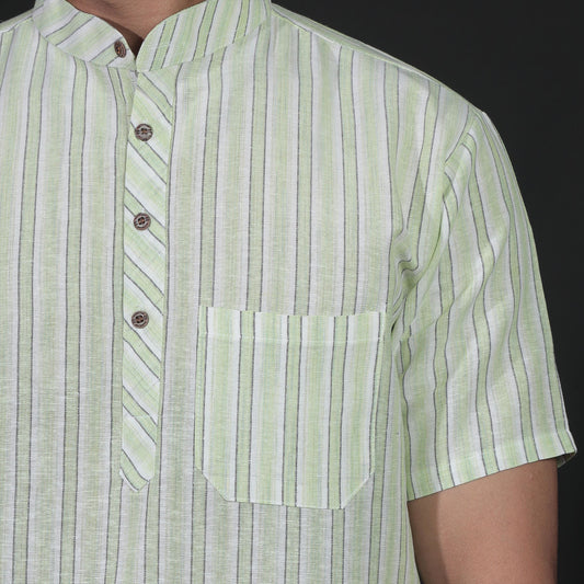 Close-up of green striped khadi kurta fabric with button placket
