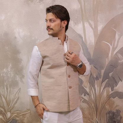 Model wearing Skin Tone Cotton Bhagalpur Nehru Jacket for Men paired with a white kurta for a festive look.