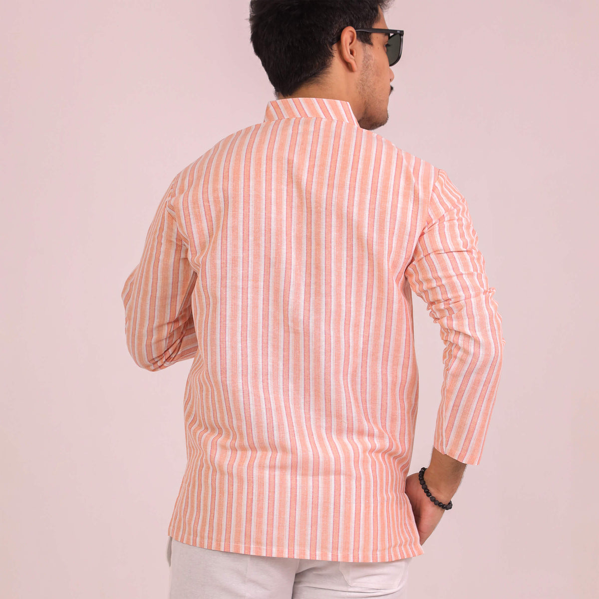 Back view of Men wearing orange-white striped full sleeves kurta 