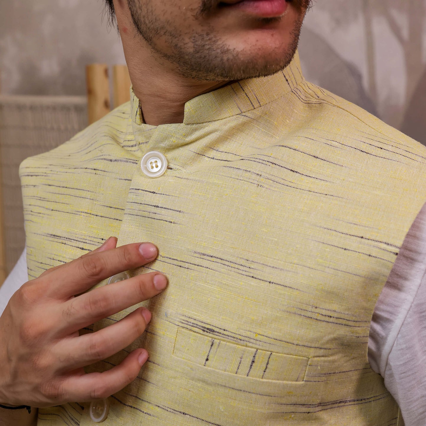 Close-up of Yellow Handloom Cotton Bhagalpur Nehru Jacket for Men | Kargham showcasing the handloom texture, Mandarin collar, and chest pocket.