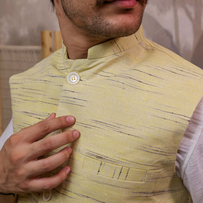 Close-up of Yellow Handloom Cotton Bhagalpur Nehru Jacket for Men | Kargham showcasing the handloom texture, Mandarin collar, and chest pocket.
