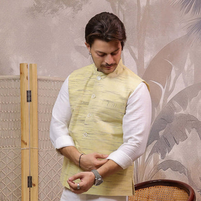 Yellow Handloom Cotton Bhagalpur Modi Jacket for Men | Kargham paired with a white kurta and pajama for a traditional outfit.