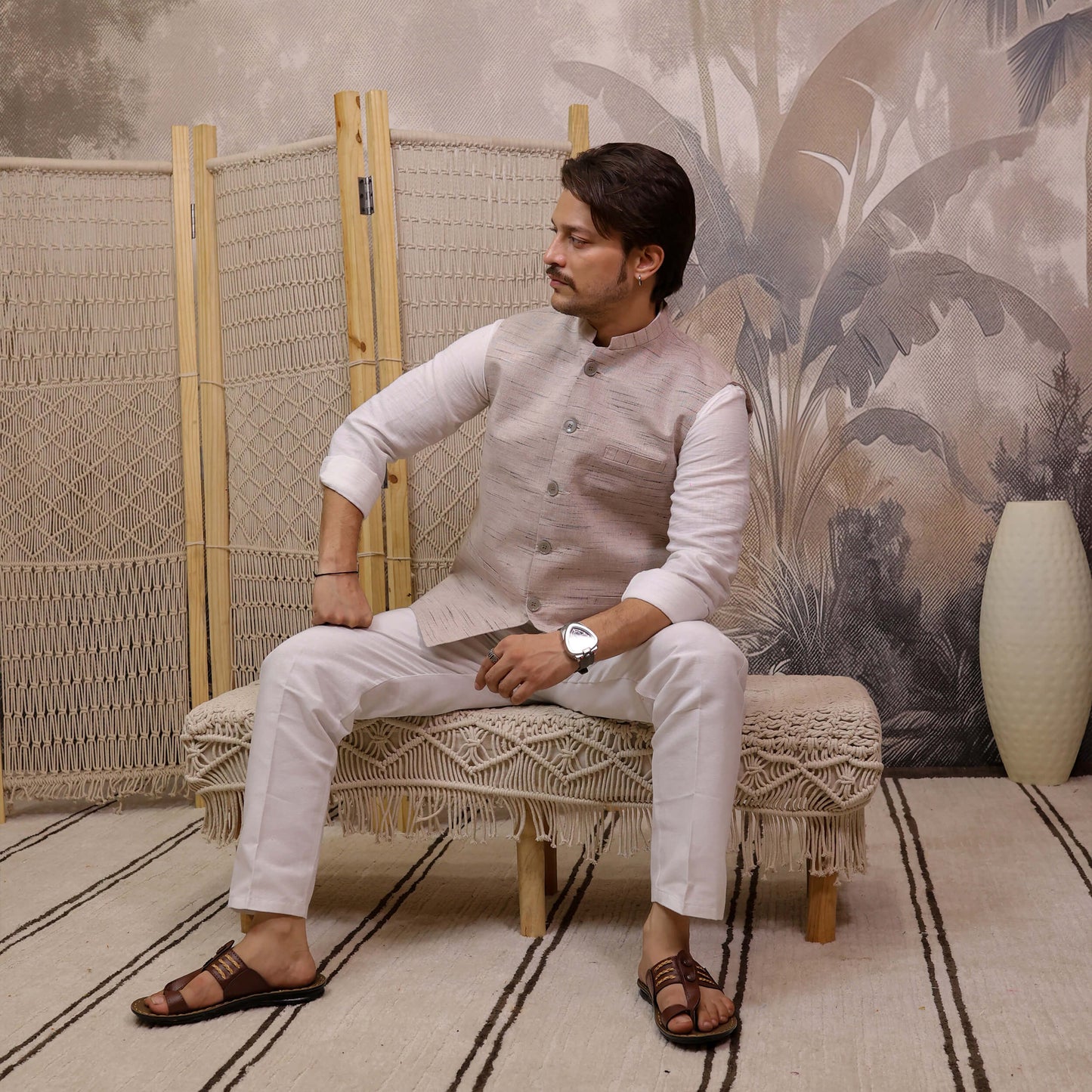 Grey Handloom Cotton Bhagalpur Modi Jacket for Men | Kargham styled with a white kurta in a seated pose.