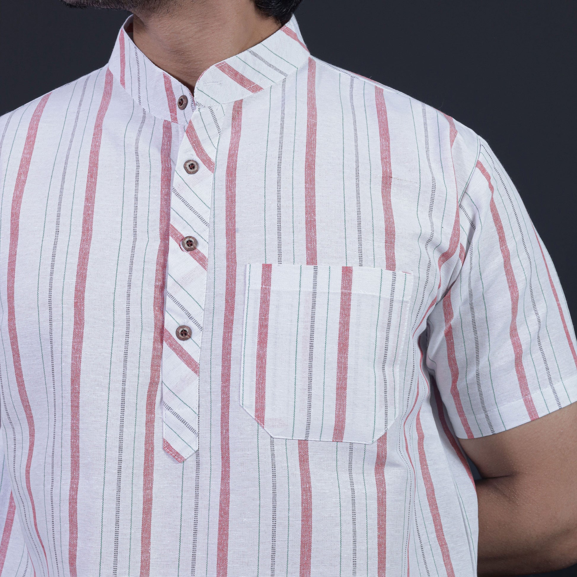 Close-up of red stripe khadi kurta with pocket and button detail