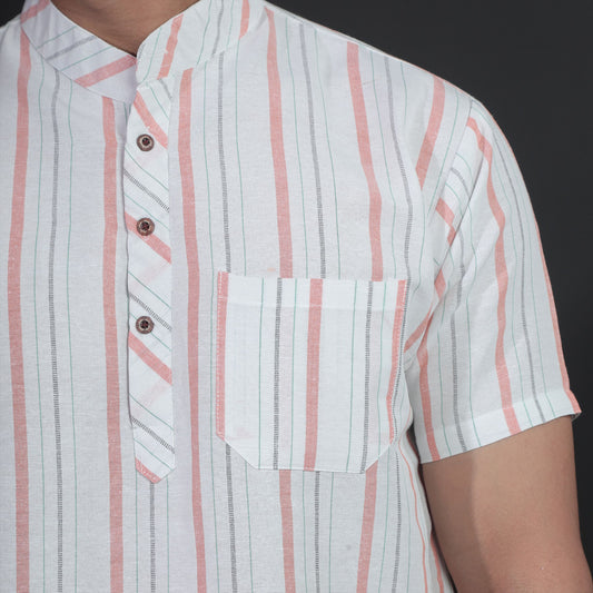 Close-up of white kurta with orange stripe pattern and pocket detail