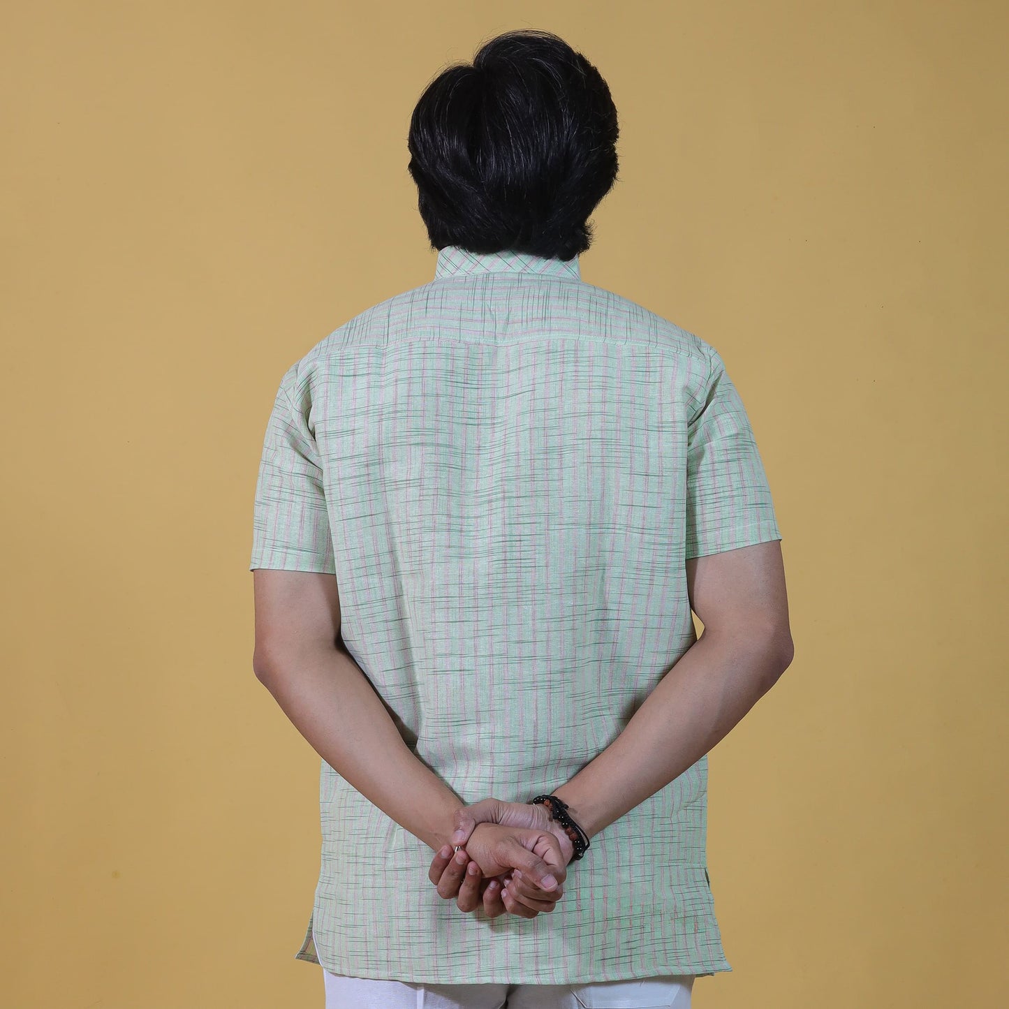 back view green khadi kurta with subtle stripe pattern