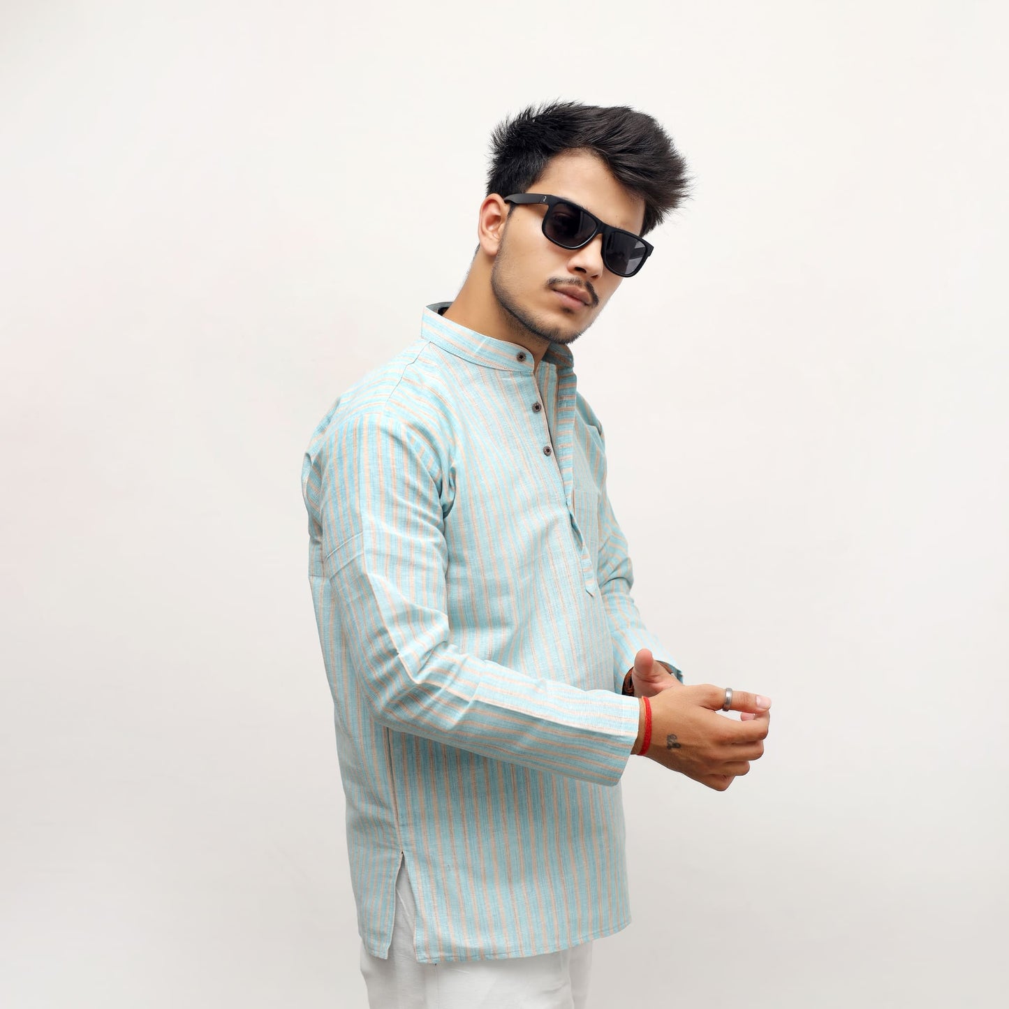 Blue khadi striped kurta styled casual look front pose