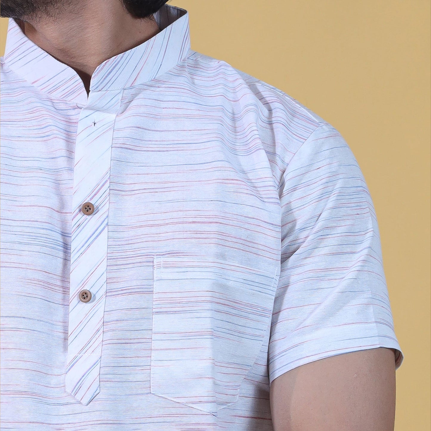 orange jharna stripe pattern on white khadi kurta close up