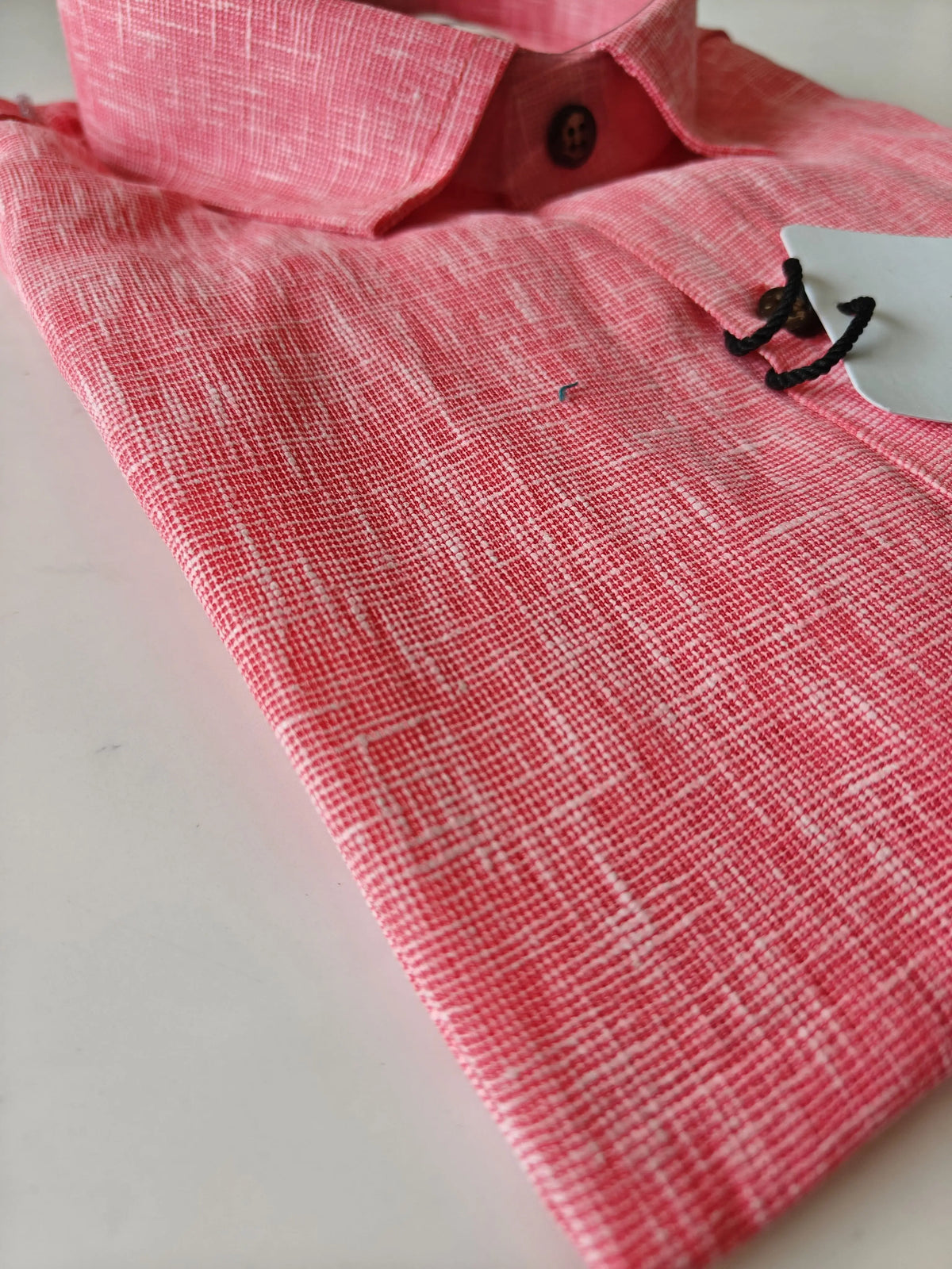 Close-up of pink linen-blend textured fabric on Kargham half sleeve shirt