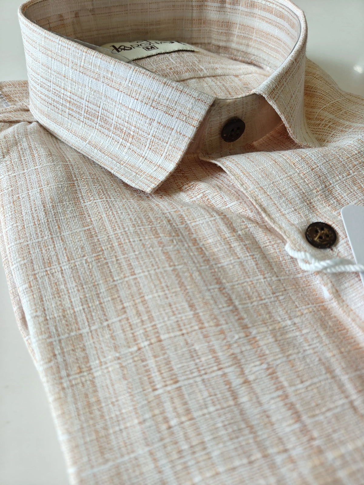 Rustic textured handloom cotton fabric of orange men's half sleeve shirt
