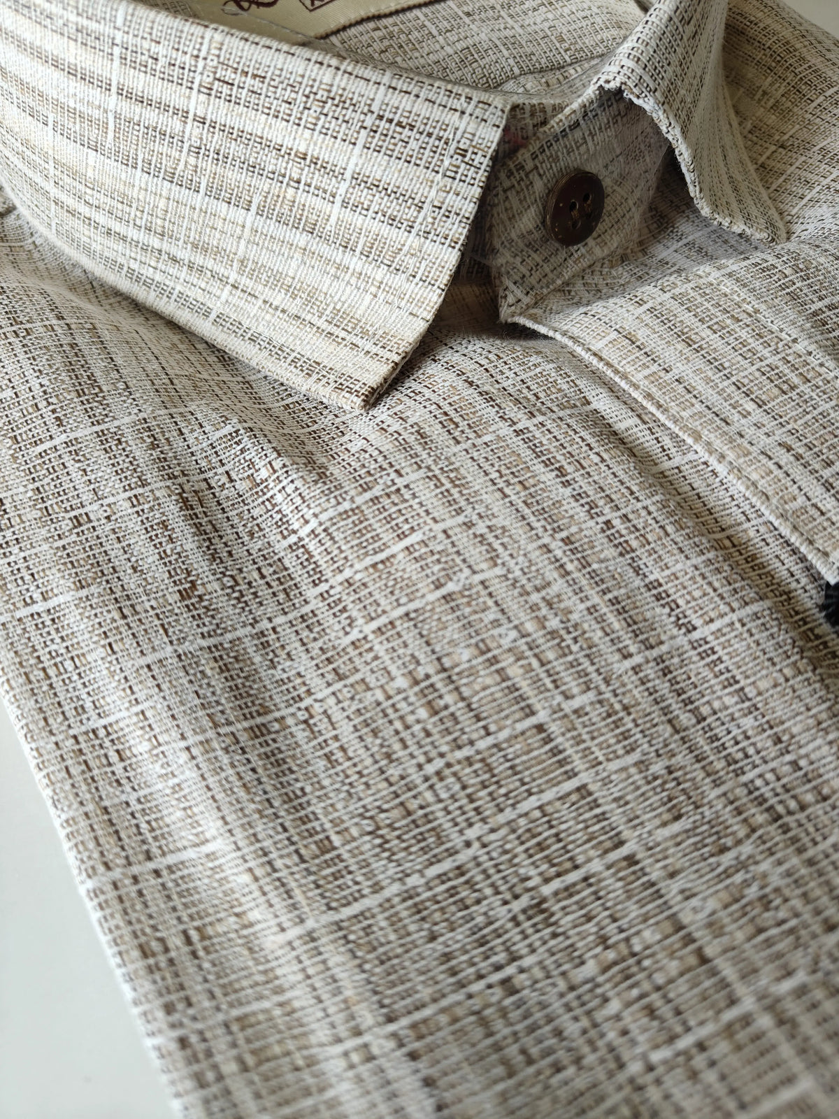 Close-up of Sand Rustic Handloom Cotton Shirt fabric and collar