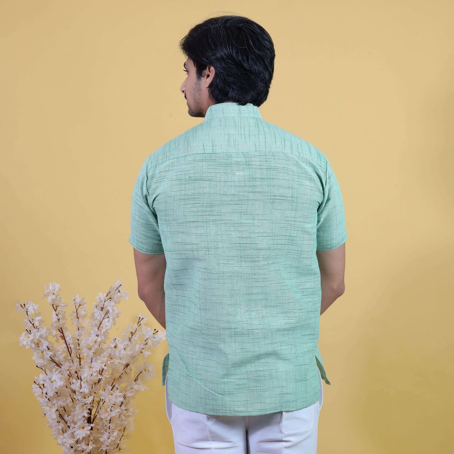 Back view of Men’s Half Sleeves Green Jharna Short Kurta Pant Combo Set