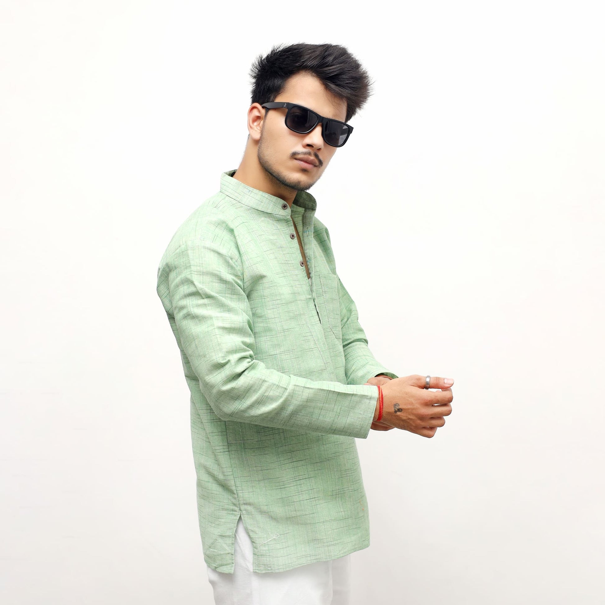 Side angle of green textured full sleeves short kurta for casual wear