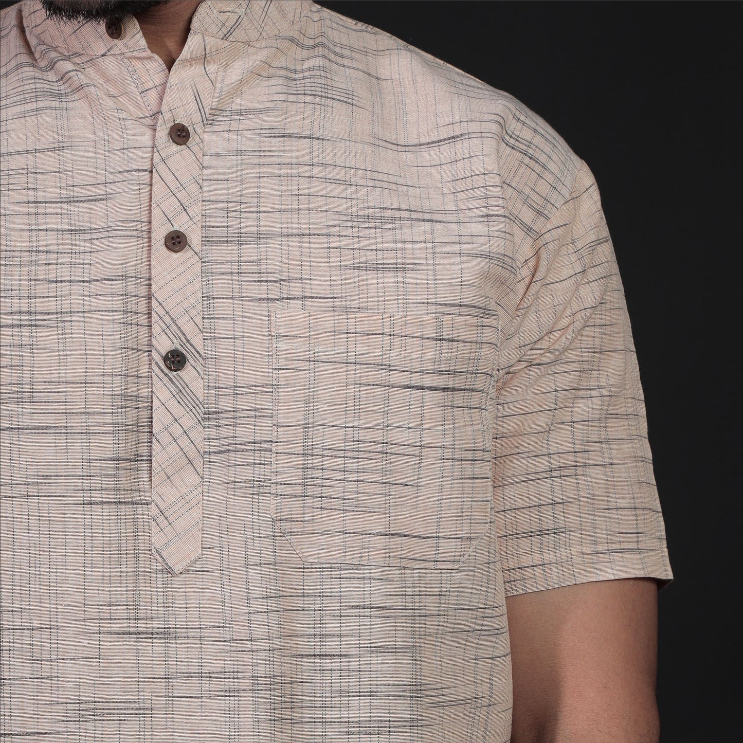 Beige khadi kurta close-up showing jharna weave pattern
