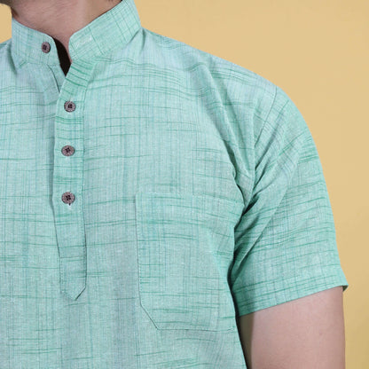 Close-up of green khadi kurta with jharna texture and buttons
