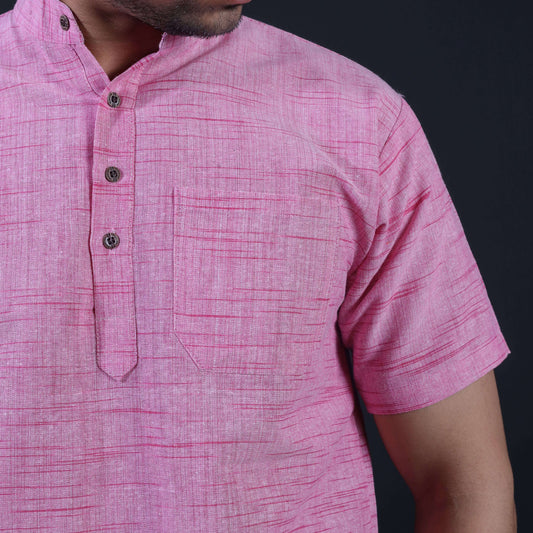 Close-up of pink khadi kurta with textured jharna pattern and buttons