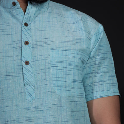 Close-up of sky blue khadi kurta with textured jharna weave and buttons