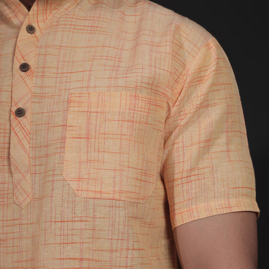 Close-up of yellow khadi kurta with jharna texture and chest pocket