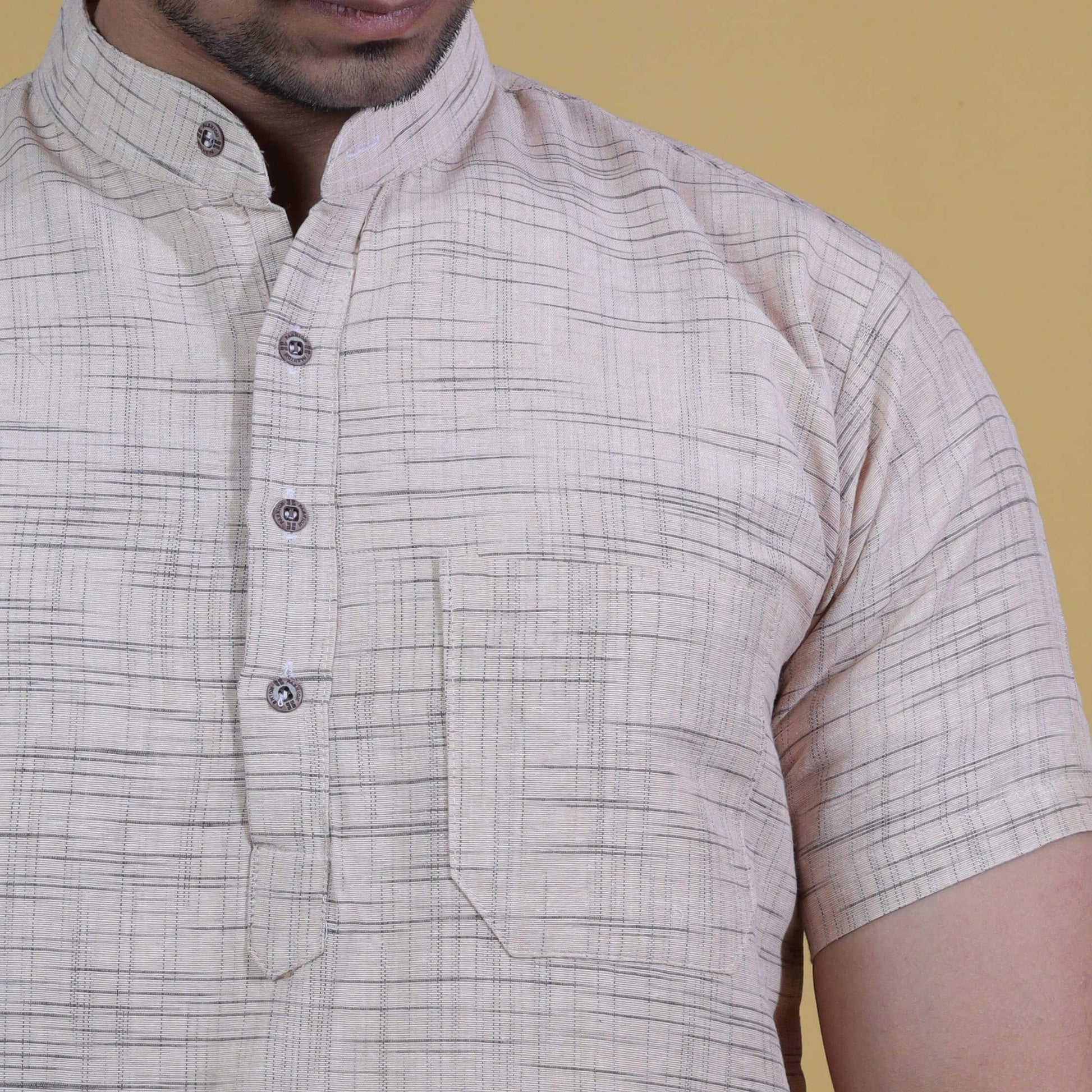 Close-up of beige khadi kurta fabric with Jharna texture pattern