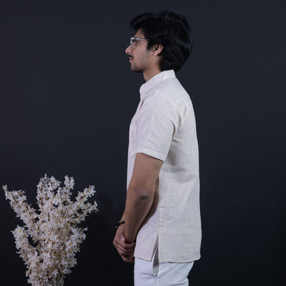 Side view of Beige LoomStripe kurta paired with white trousers styling