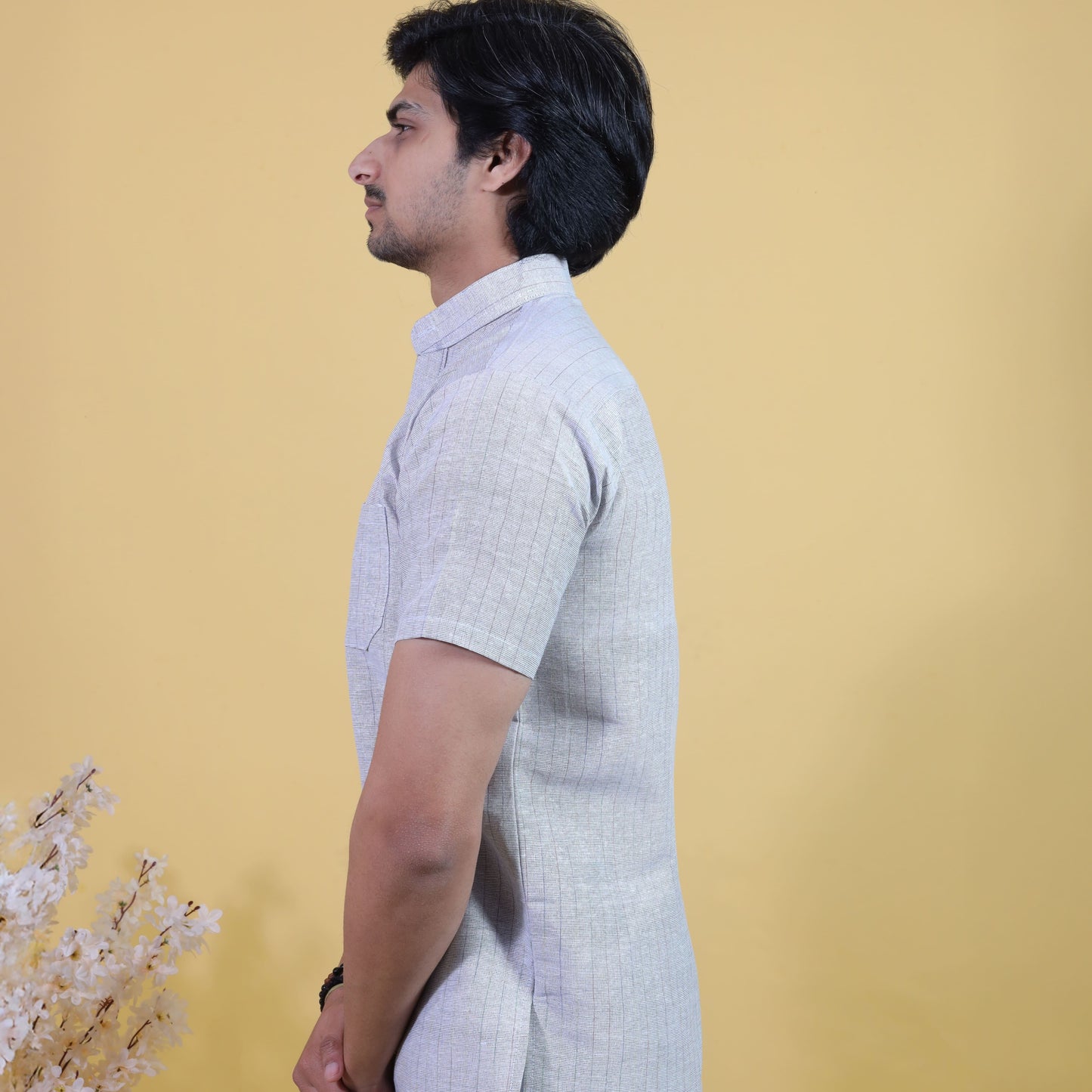 Side profile of Grey Softline kurta with white pant combo set