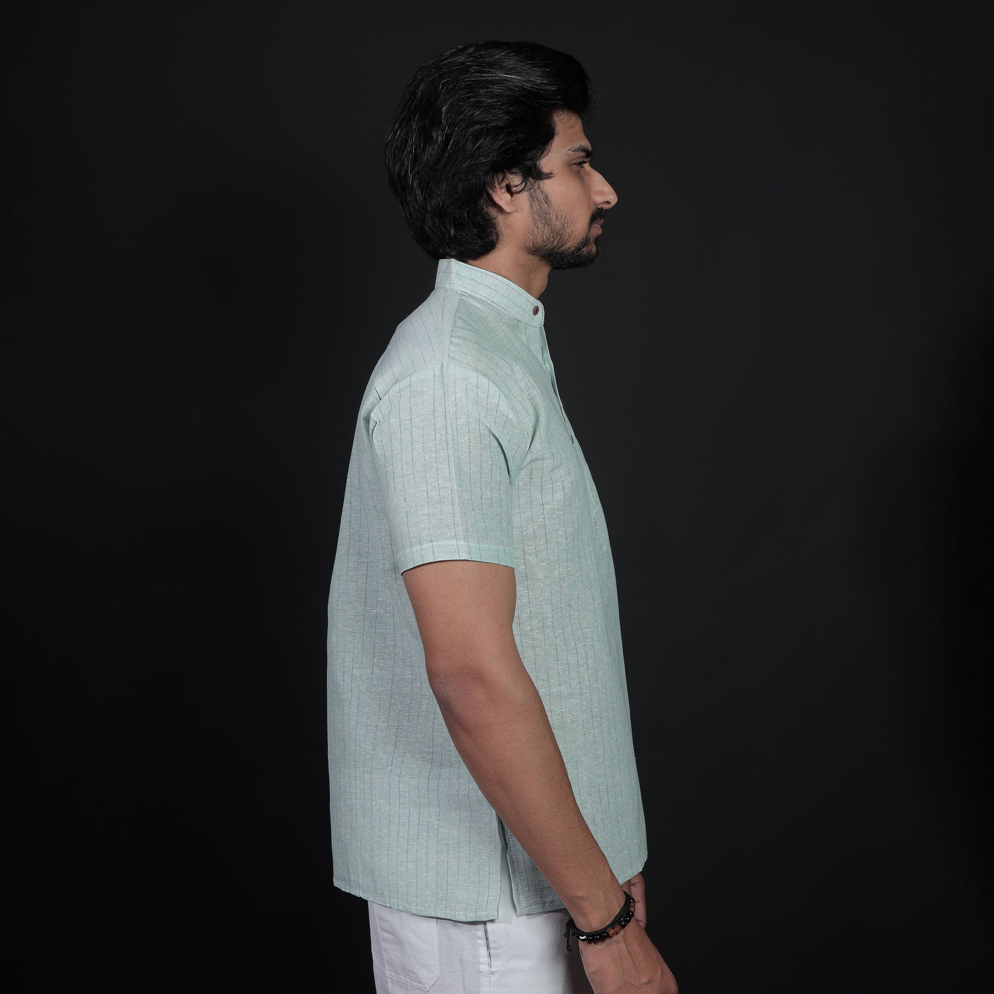 Side profile of green half sleeves ethnic kurta for men