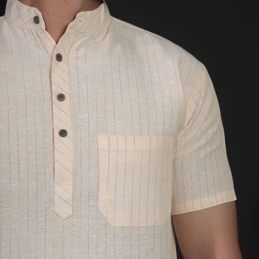 Close-up of yellow striped handwoven kurta collar and pocket detail