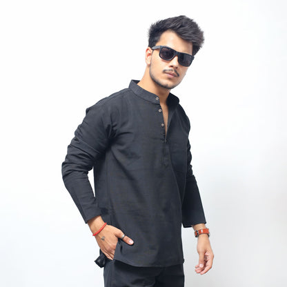 Black solid short kurta angled pose full sleeves clean minimal design