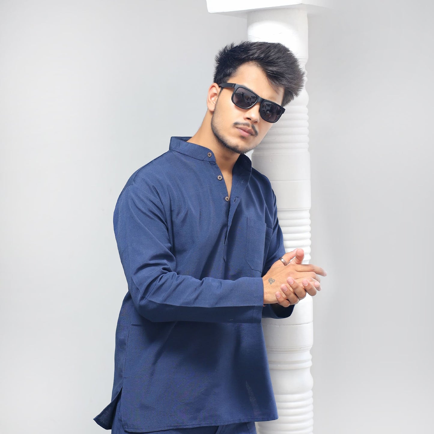 Blue khadi cotton short kurta regular wear side pose for men