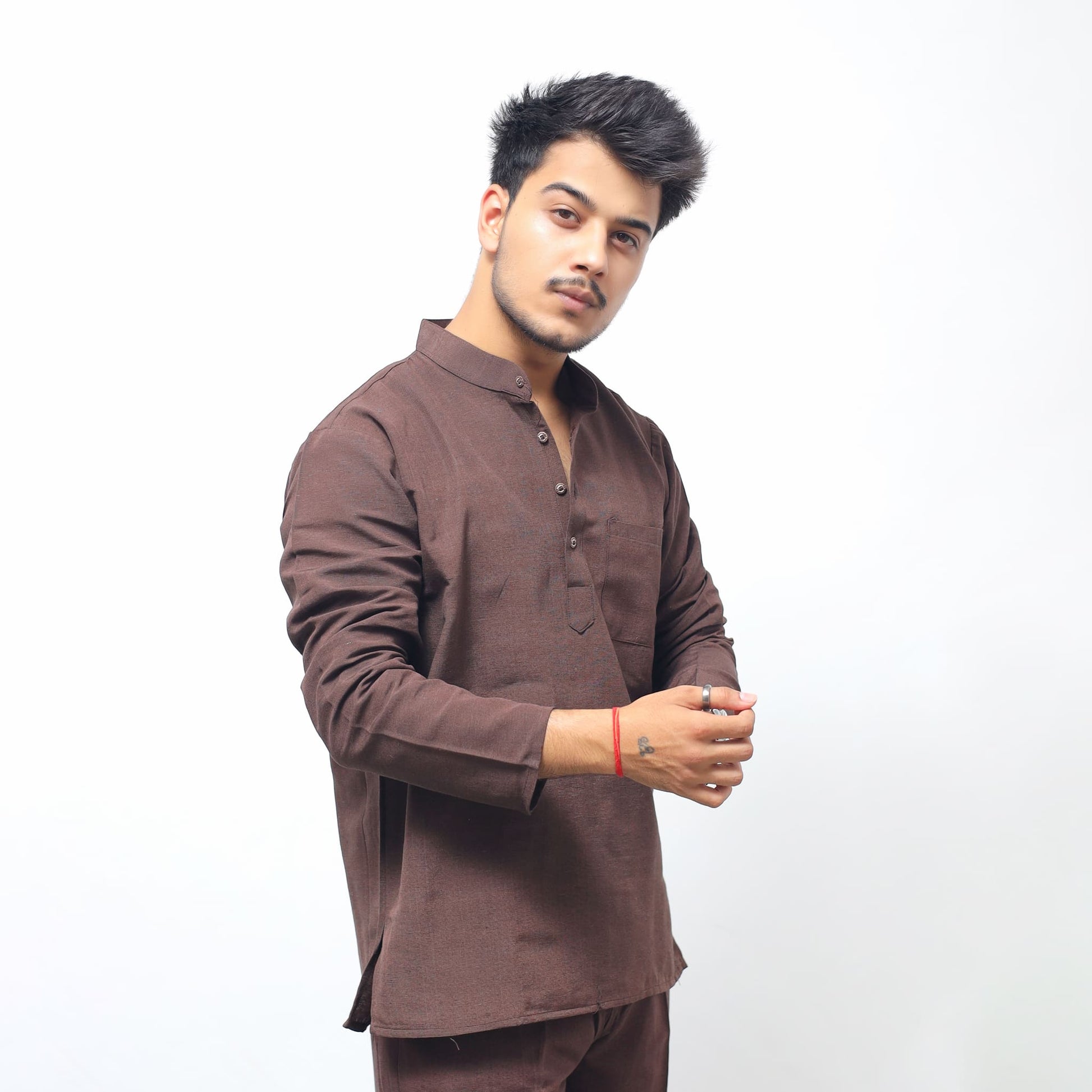 Brown Solid Full Sleeves Khadi Cotton Short Kurta front view with model adjusting sleeve