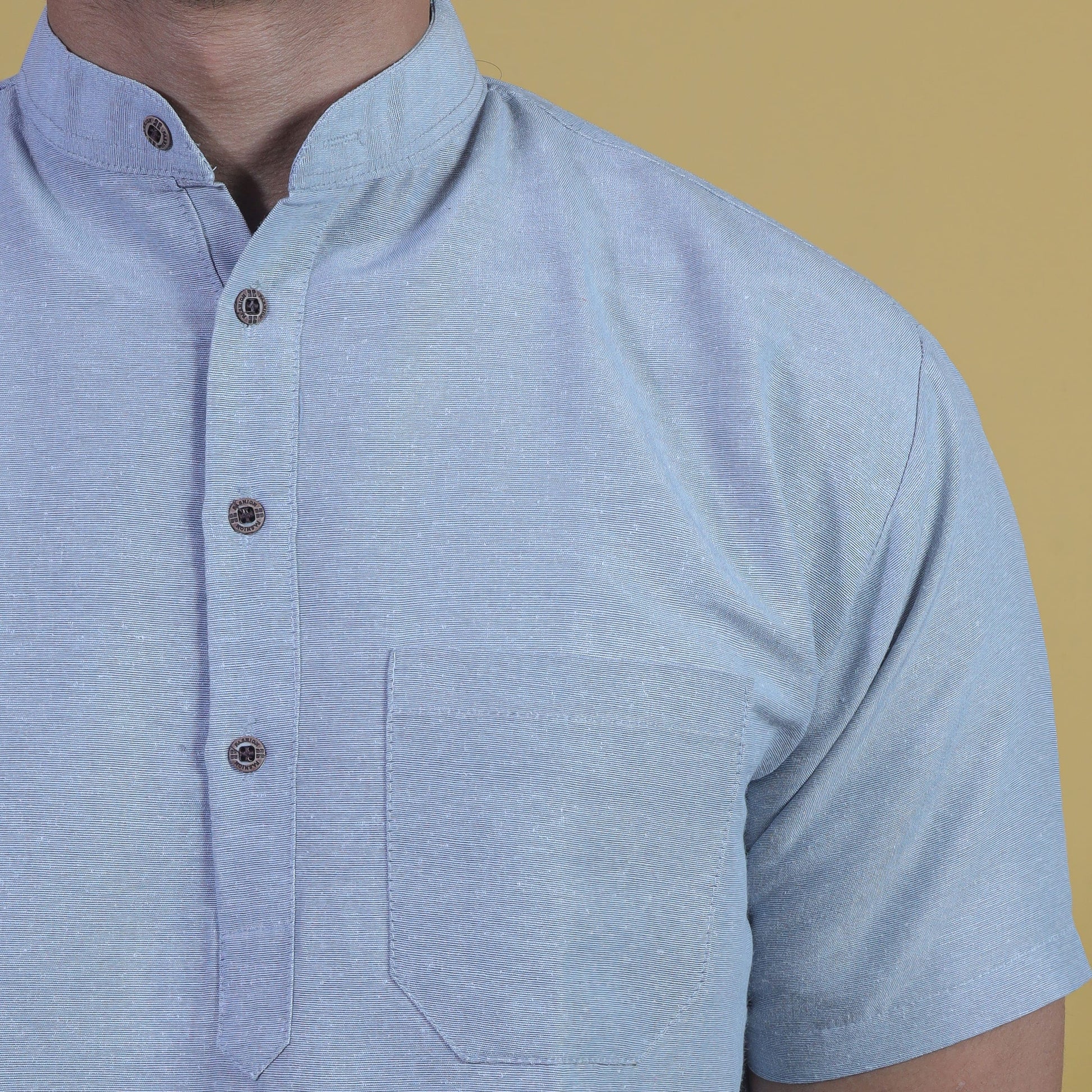 Close-up grey khadi kurta mandarin collar and button placket