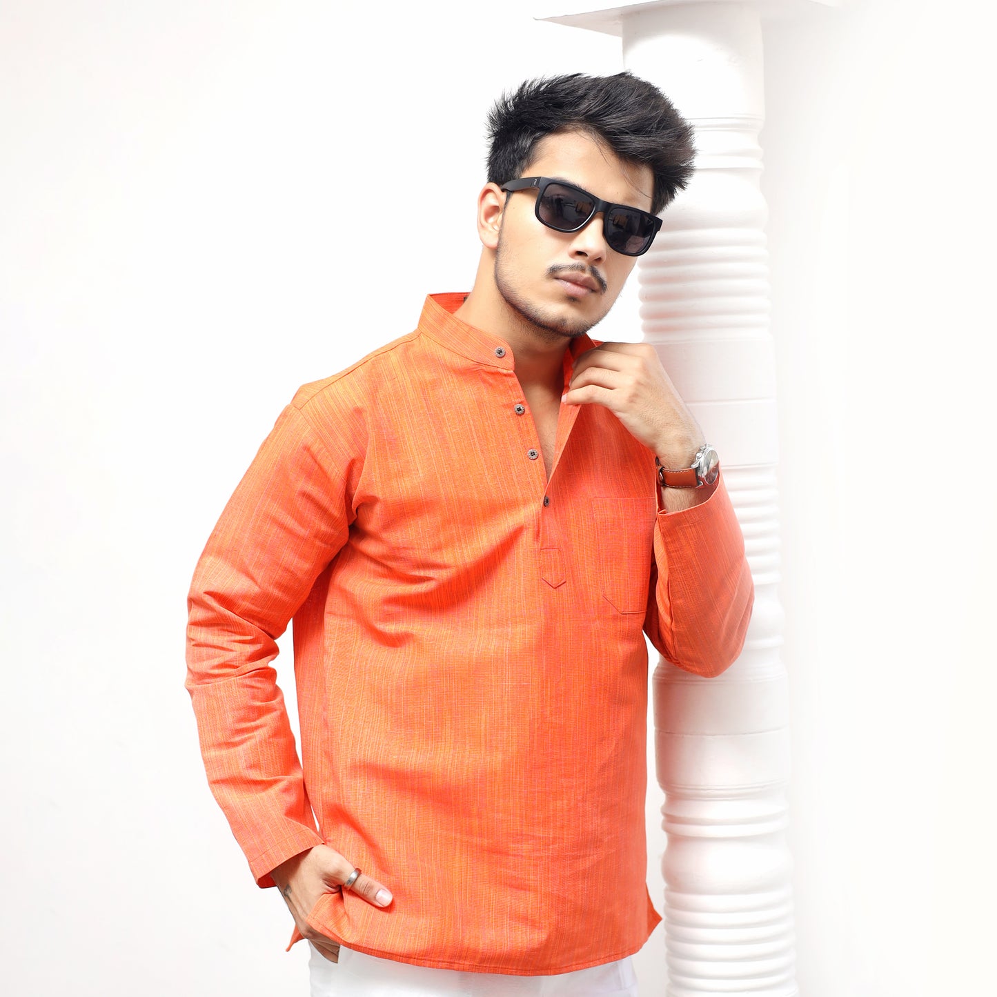 Orange khadi cotton short kurta styling pose modern ethnic wear