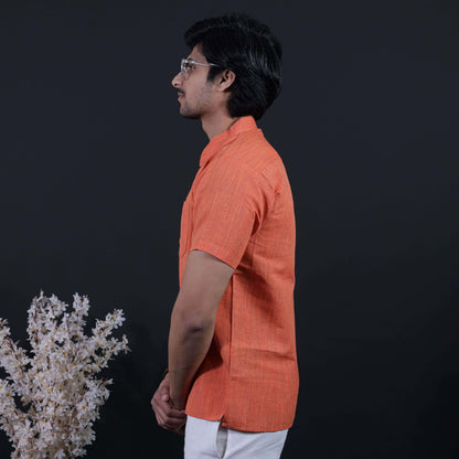 Side profile of orange half sleeves khadi kurta with thread line weave