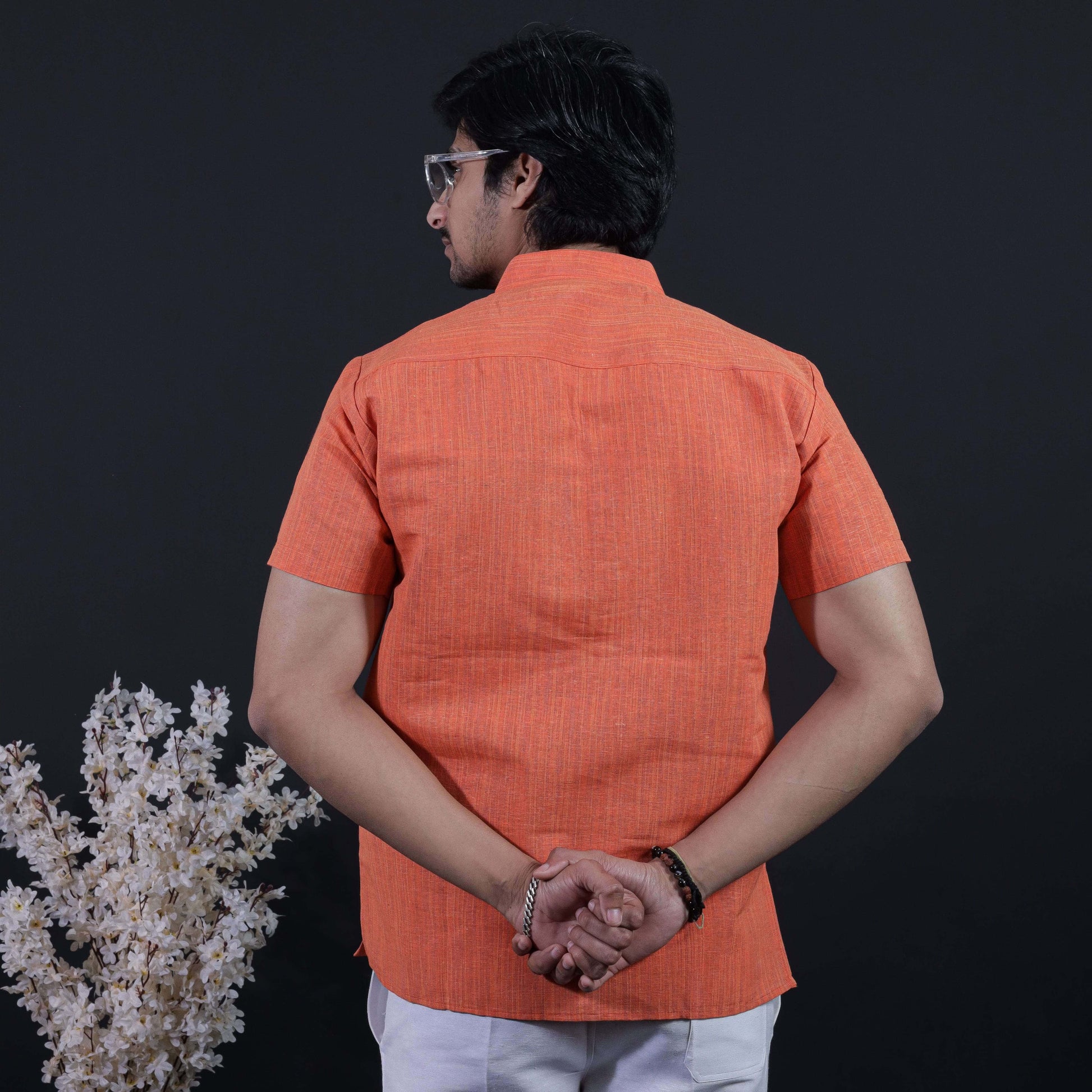 Back view of orange thread line khadi short kurta for men