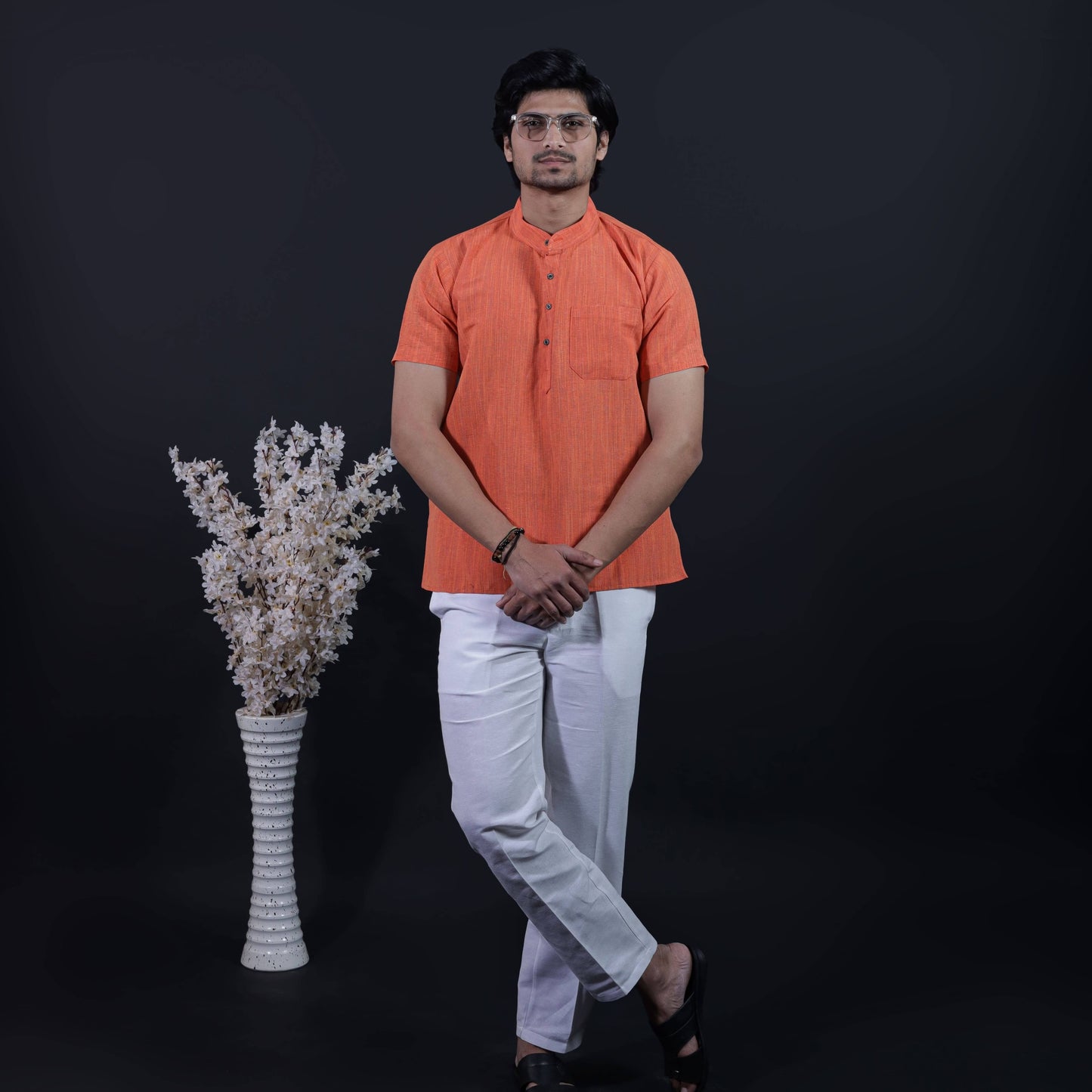 Orange color thread line kurta pant combo set for men styled with white straight fit pant