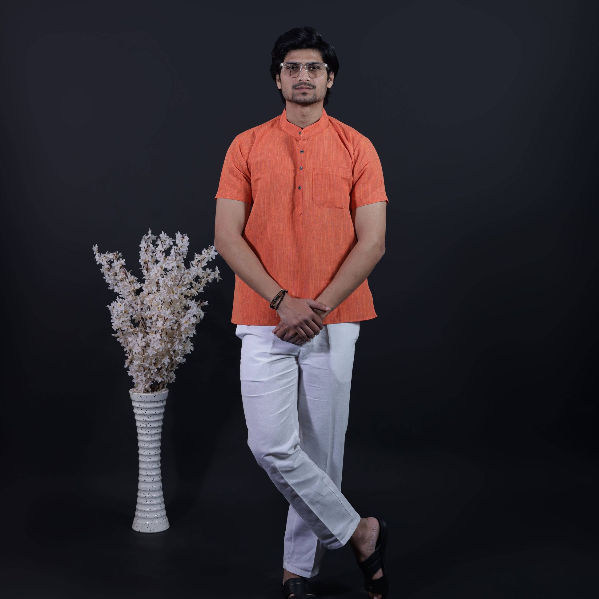 Orange color thread line kurta pant combo set for men styled with white straight fit pant