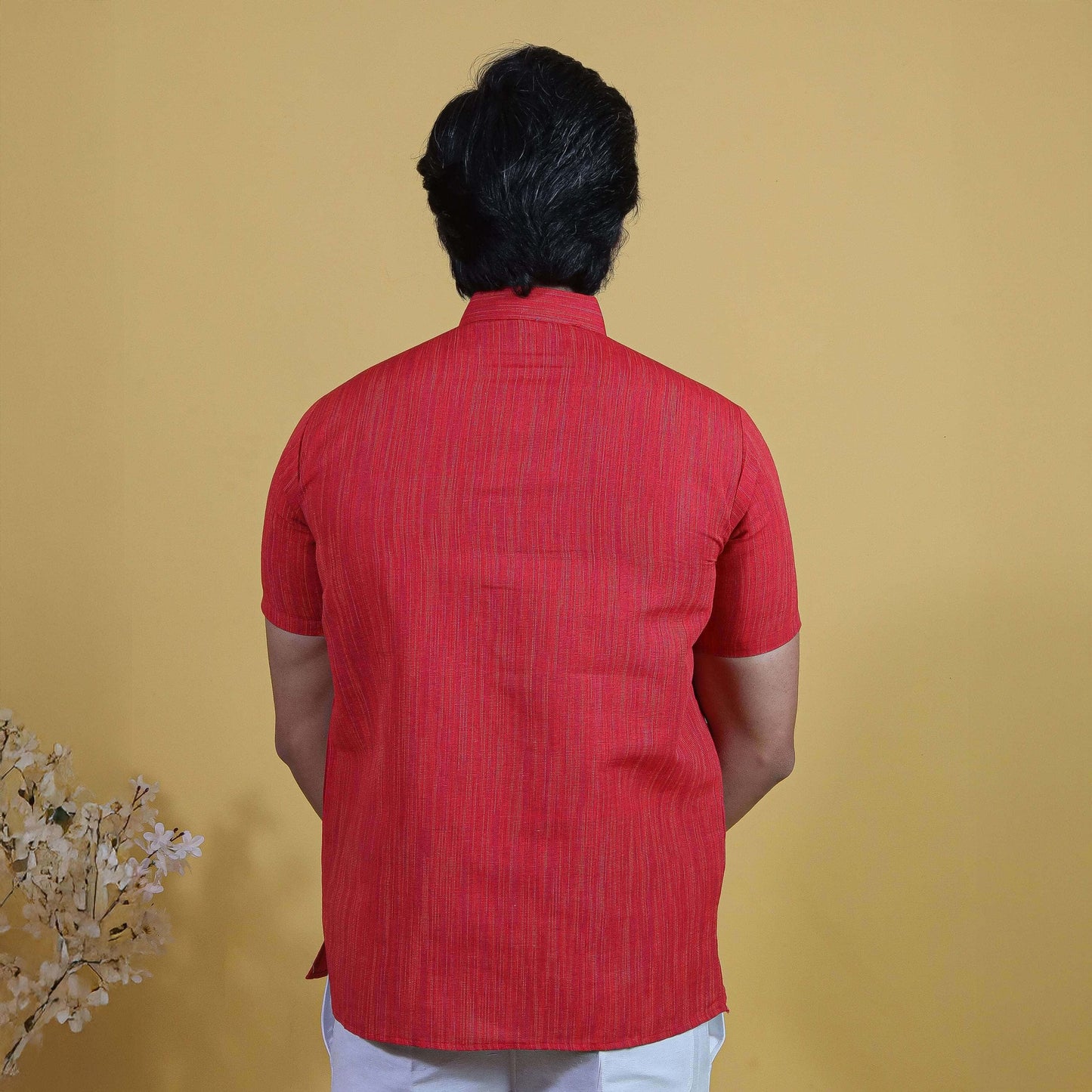 Back view of red thread lines khadi short kurta with vertical textured pattern and clean stitching