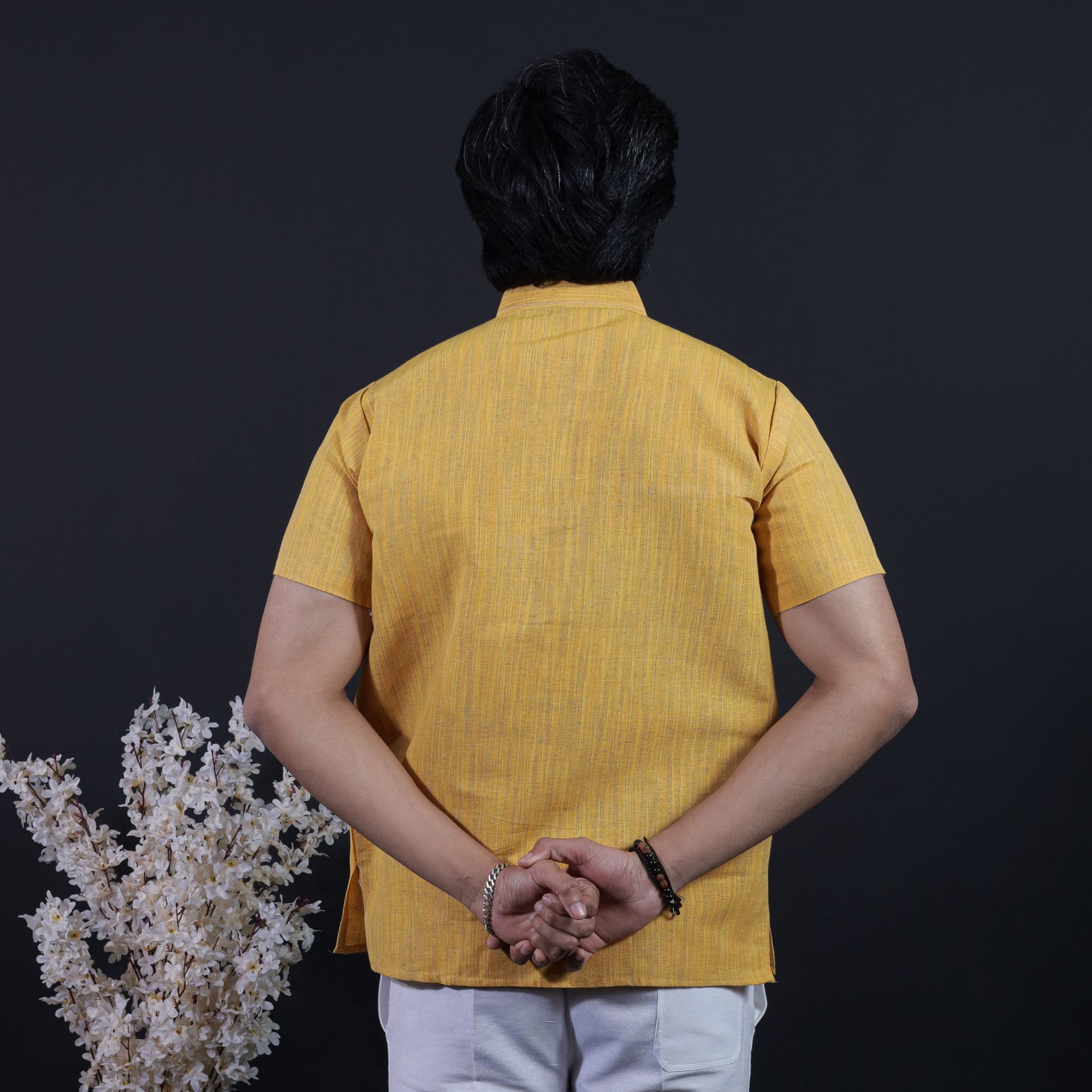 Back view of yellow thread lines khadi short kurta with vertical weave pattern