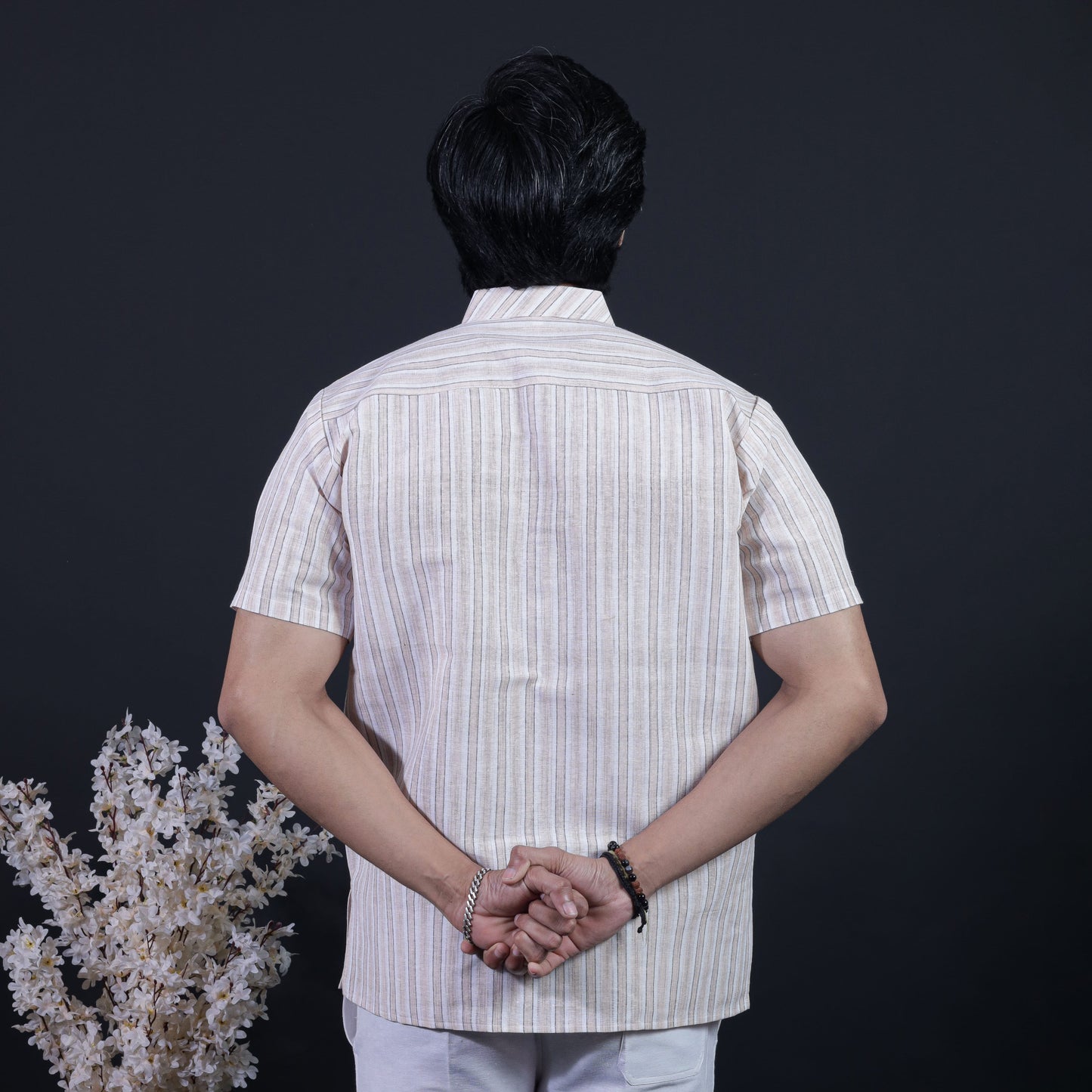 Back view of beige white striped short kurta for men