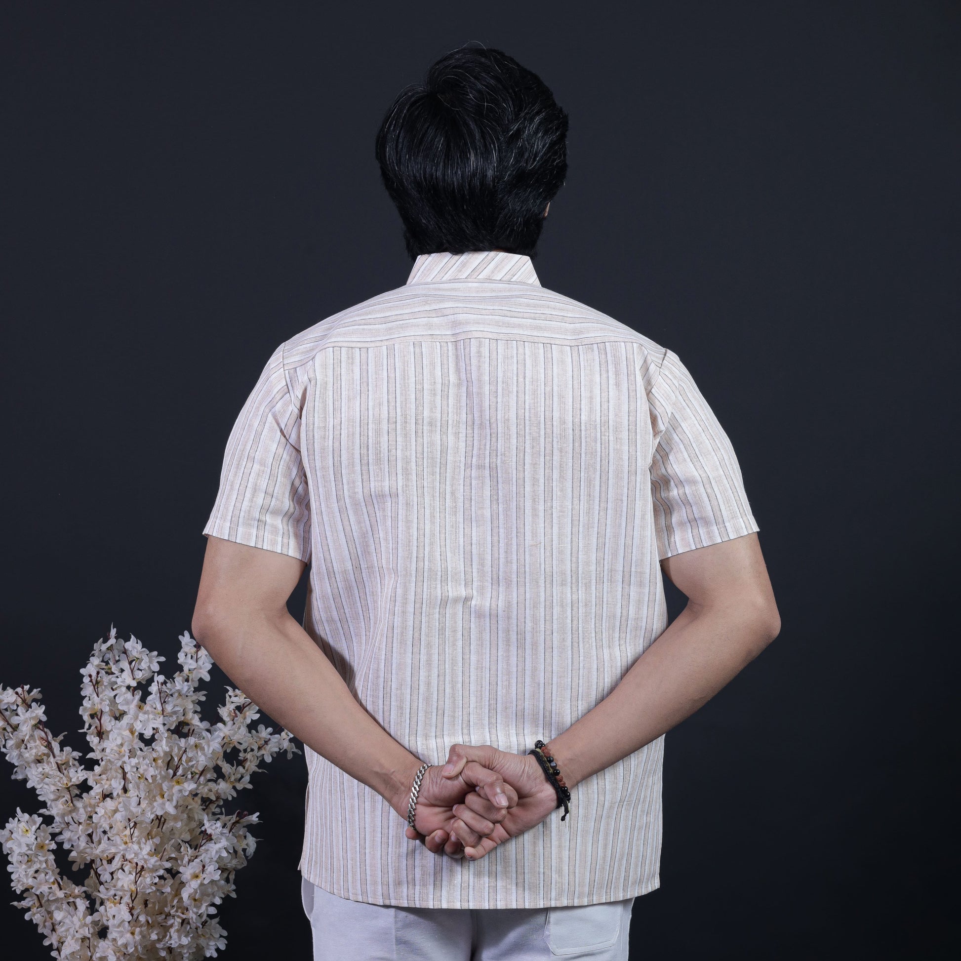 Back view of beige white striped short kurta for men