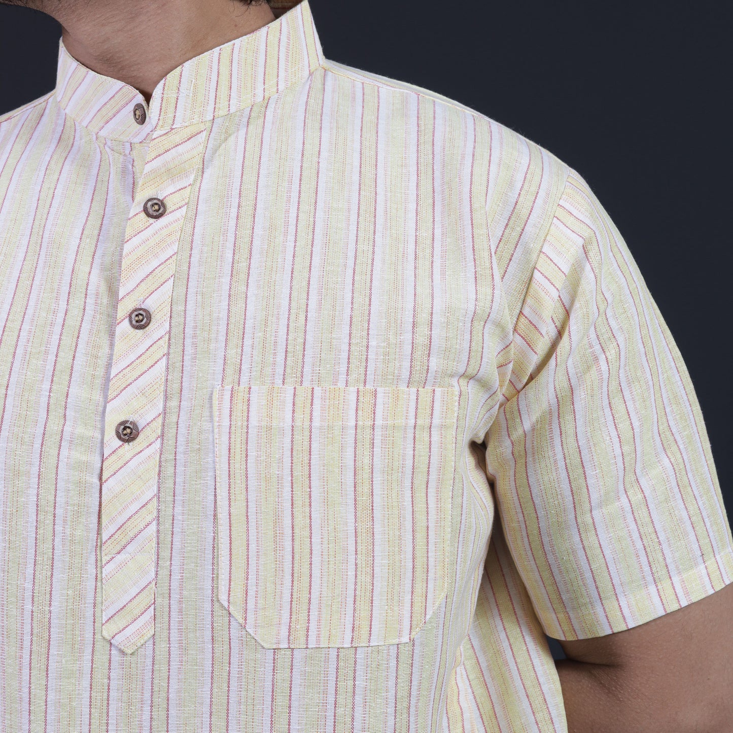 Close-up of yellow white striped short kurta collar and pocket