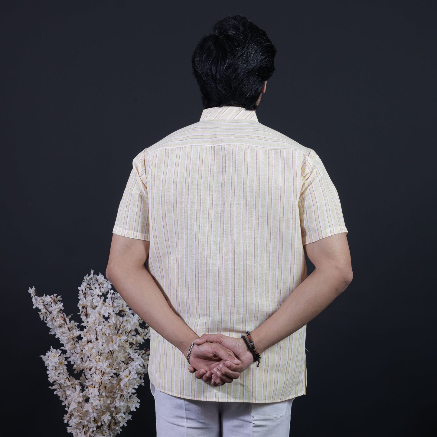 Back side view of yellow white striped short kurta men