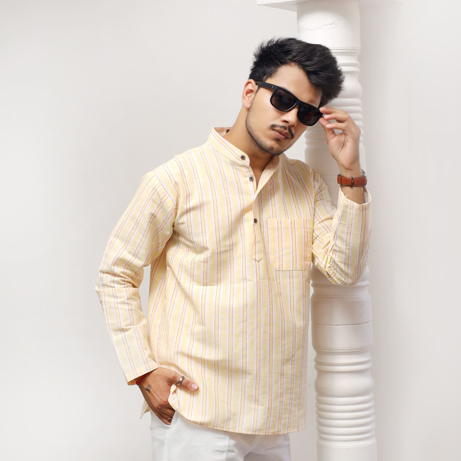 Yellow striped kurta casual pose modern ethnic wear