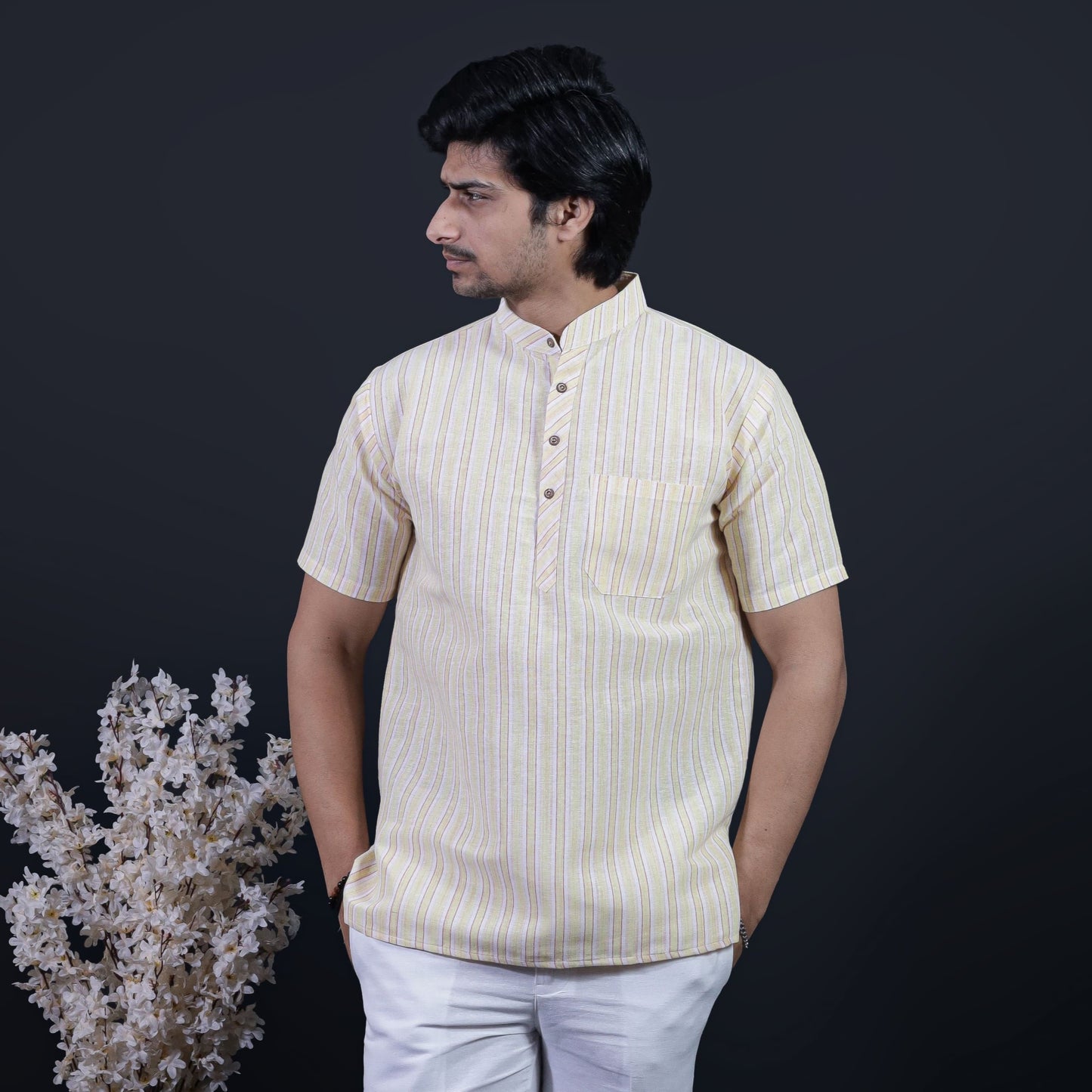 Yellow-toned white striped half sleeves khadi short kurta front view on model